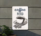 a sign that says coffee nerd with a cup of coffee