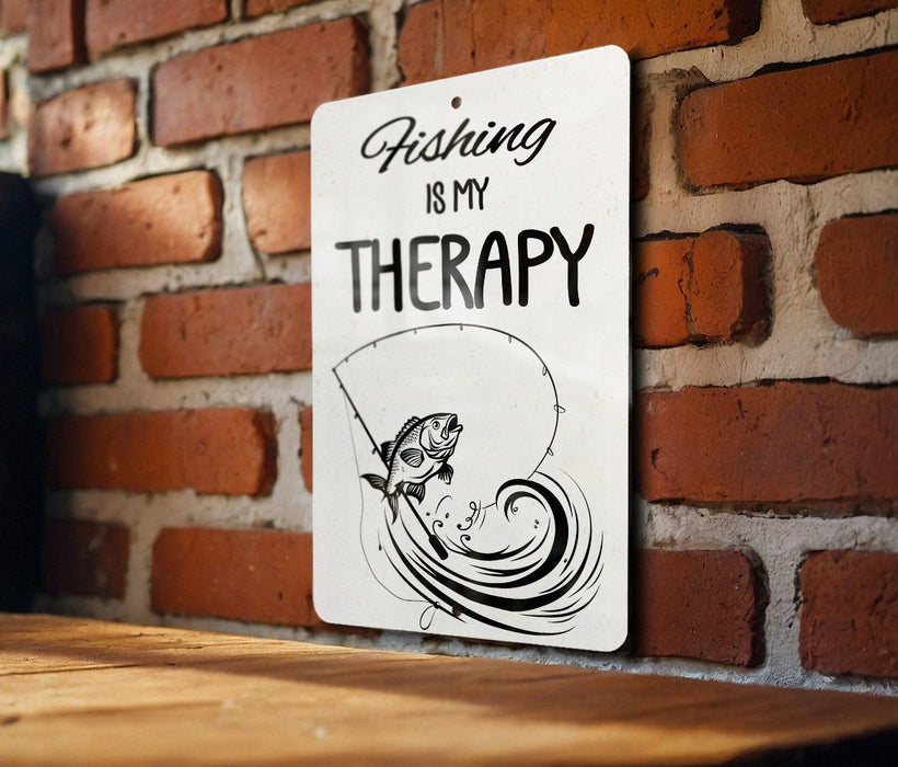 a sign on a brick wall that says fishing is my therapy