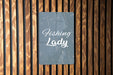 a sign that says fishing lady on a wooden wall