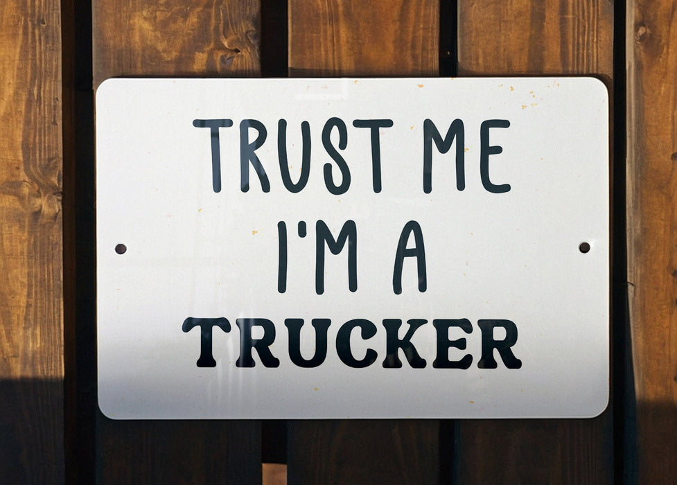 a white sign that says trust me i'm a trucker