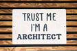 a white sign that says trust me i'm a architecture