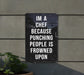 a sign that says i'm a chef because punching people is frowned upon