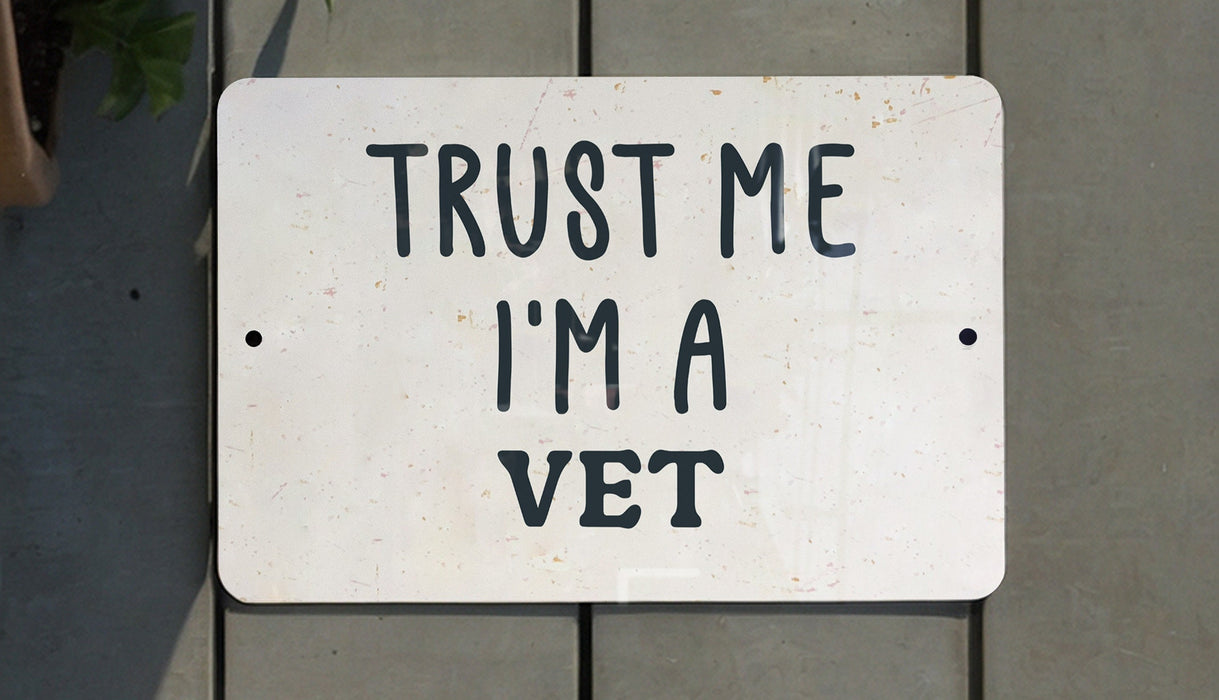 a white sign that says trust me i'm a vet