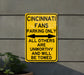 a yellow street sign on the side of a building