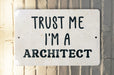 a white sign that says trust me i'm a architecture