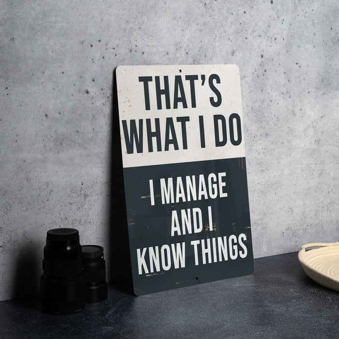 a sign that says that's what i do i manage and i know things