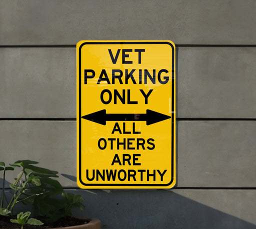 a yellow sign that says vet parking only all others are unworthyly