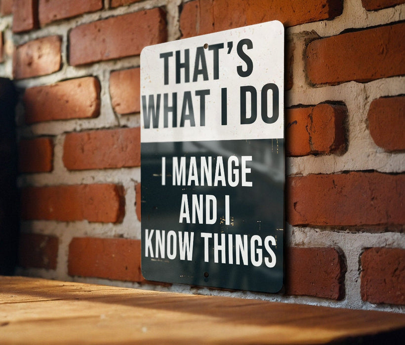 a sign that says that's what i do i manage and i know things