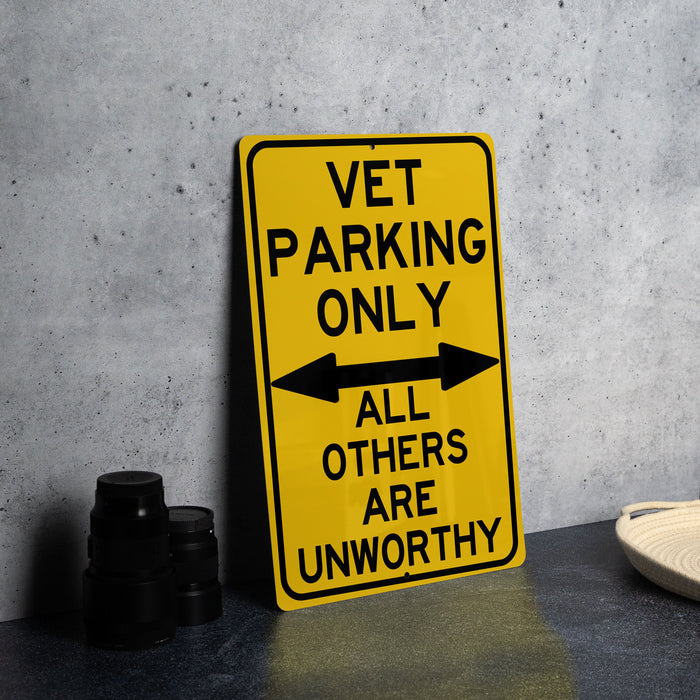 a yellow sign that says vet parking only all others are unworthyly