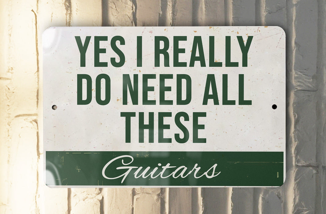 a sign that says, yes i really do need all these guitars