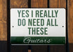 a sign that says, yes i really do need all these guitars