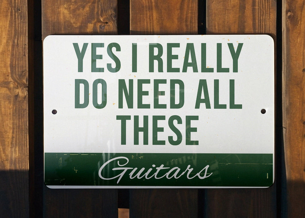 a sign that says, yes i really do need all these guitars