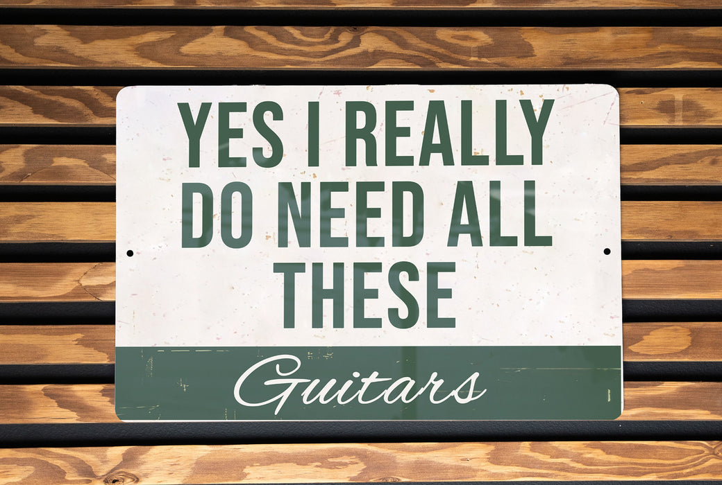 a sign that says, yes i really do need all these guitars