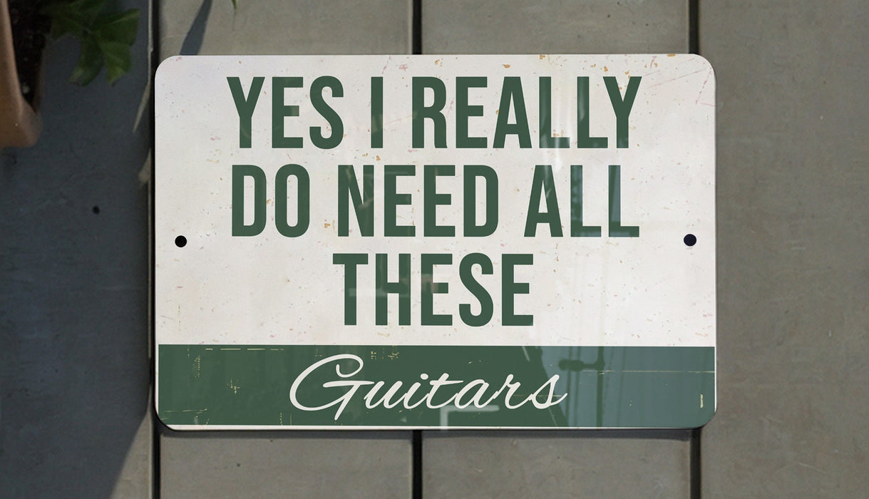 a sign that says, yes i really do need all these guitars