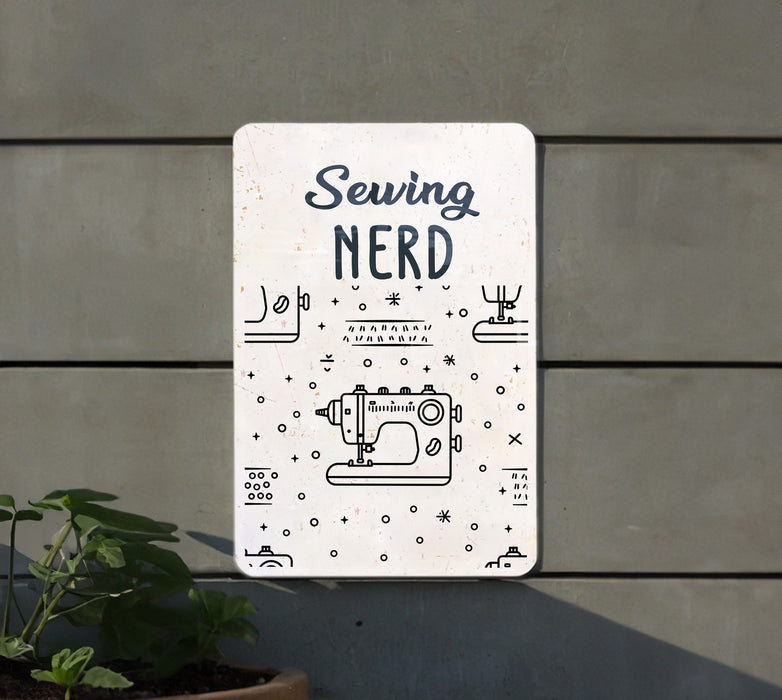 a sign on a wall that says sewing nerd
