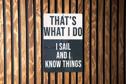 a sign on a wooden wall that says, that's what i do i