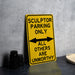 a yellow sign sitting on top of a table
