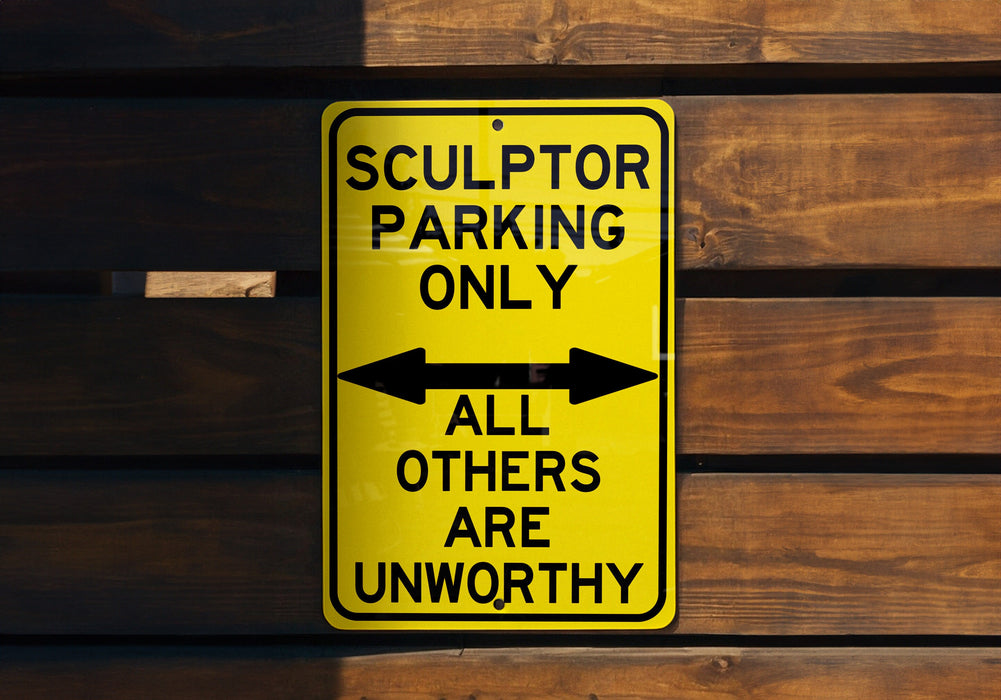 a yellow parking only sign hanging on a wooden wall