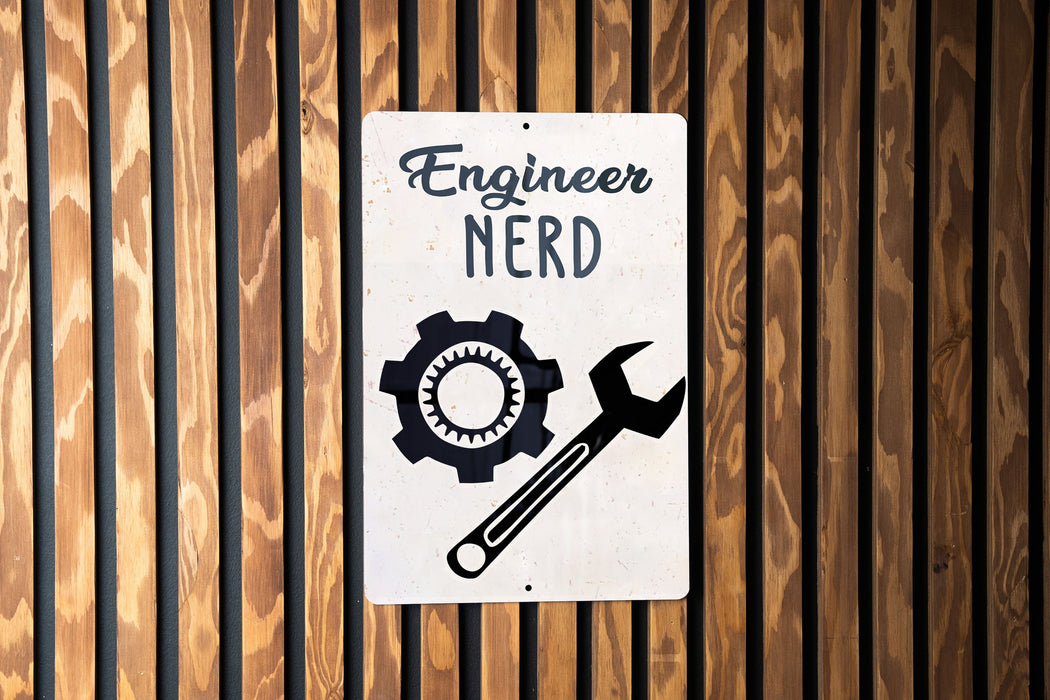 a sign on a wooden wall that says engineer nerd