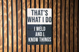 a sign on a wooden wall that says, that's what i do i
