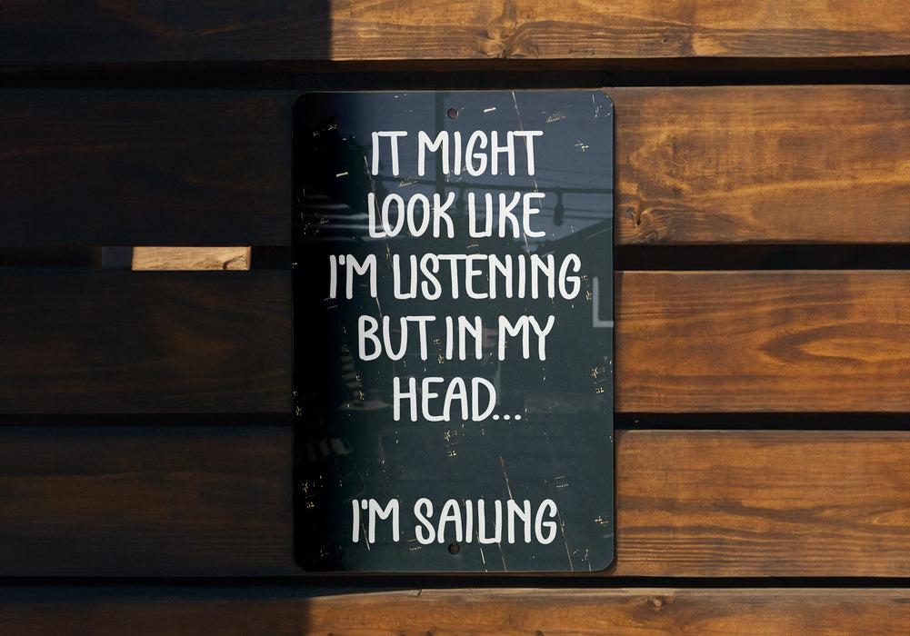 a sign that says it might look like i'm listening but in my head