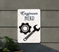 a white sign with a wrench and a wrench on it