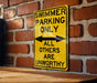 a yellow swimming only sign on a brick wall