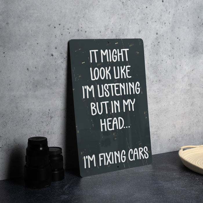 a sign that says it might look like i'm listening but in my head