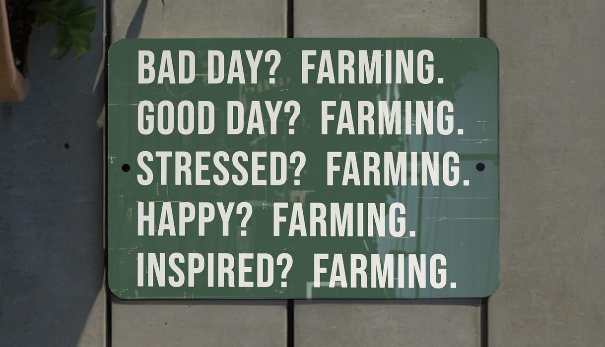 a green sign that says, bad day? farming good day? farming stress?