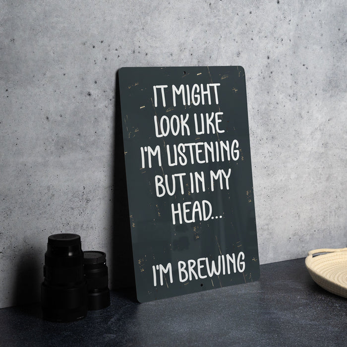 a sign that says it might look like i'm listening but in my head