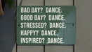 a sign that says bad day? dance good day? dance stress? dance happy