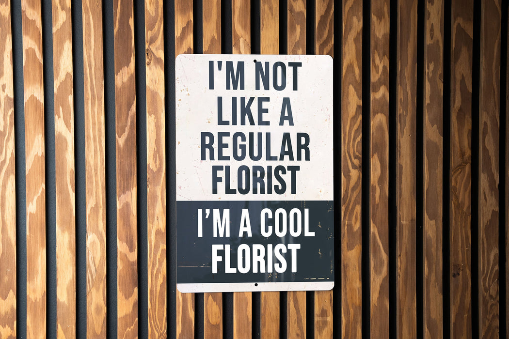 a sign on a wooden wall that says i'm not like a regular fl