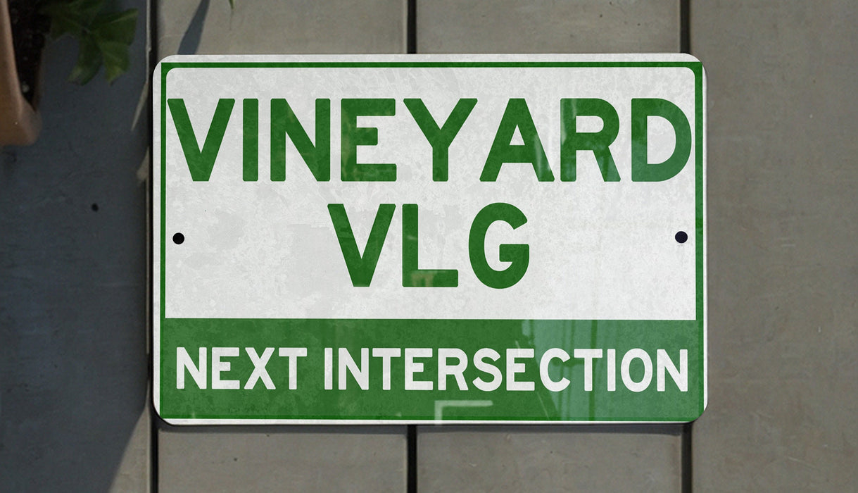 a close up of a street sign on a wall