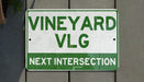 a close up of a street sign on a wall