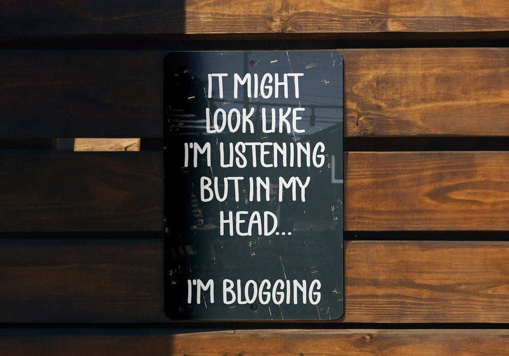 a sign on a wooden bench that says it might look like i'm listening