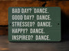 a sign that says bad day? dance good day? dance stressed? dance