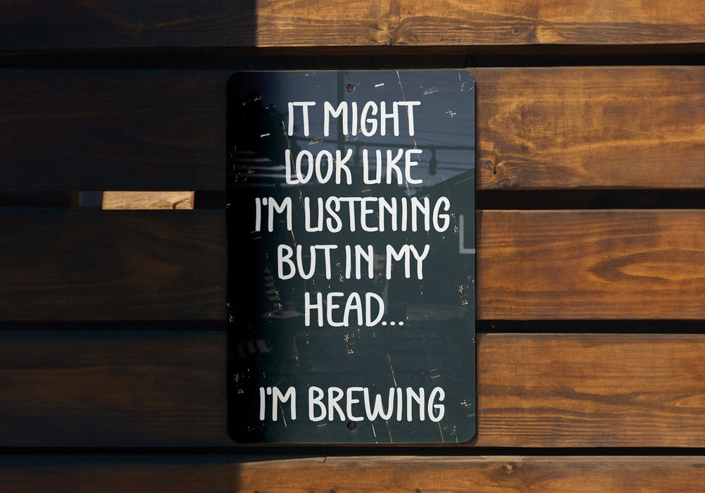 a sign that says it might look like i'm listening but in my head