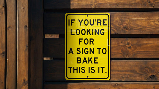 a yellow sign that says if you're looking for a sign to bake