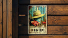a sign on a wooden wall that says dig in