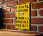a sign on a brick wall that says if you're looking for a sign