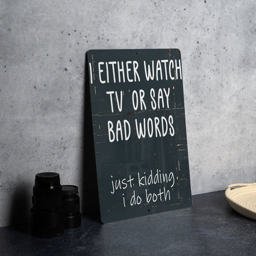 a sign that says i either watch tv or say bad words