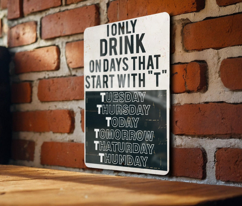 a sign on a brick wall that says only drink on days that start with t