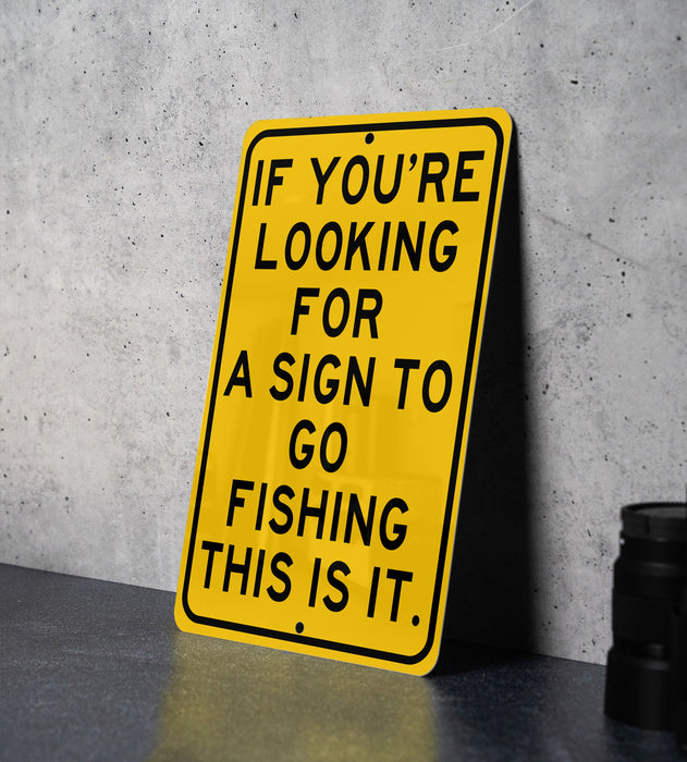 a yellow sign that says if you're looking for a sign to go fishing