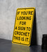 a yellow sign that says if you're looking for a sign to croche