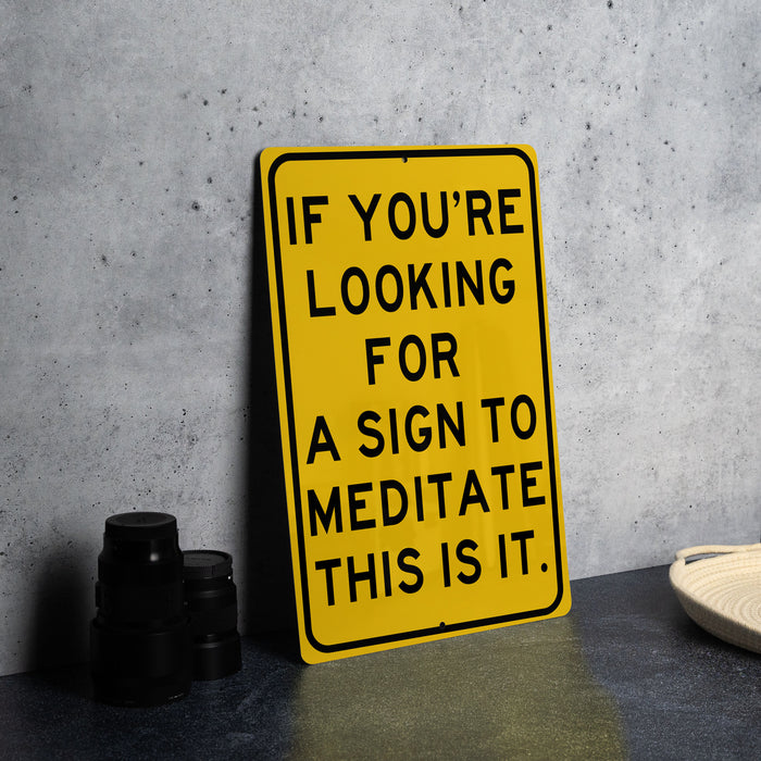 a yellow sign that says if you're looking for a sign to meditate