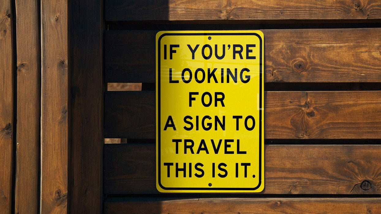 a yellow sign that says if you're looking for a sign to travel this