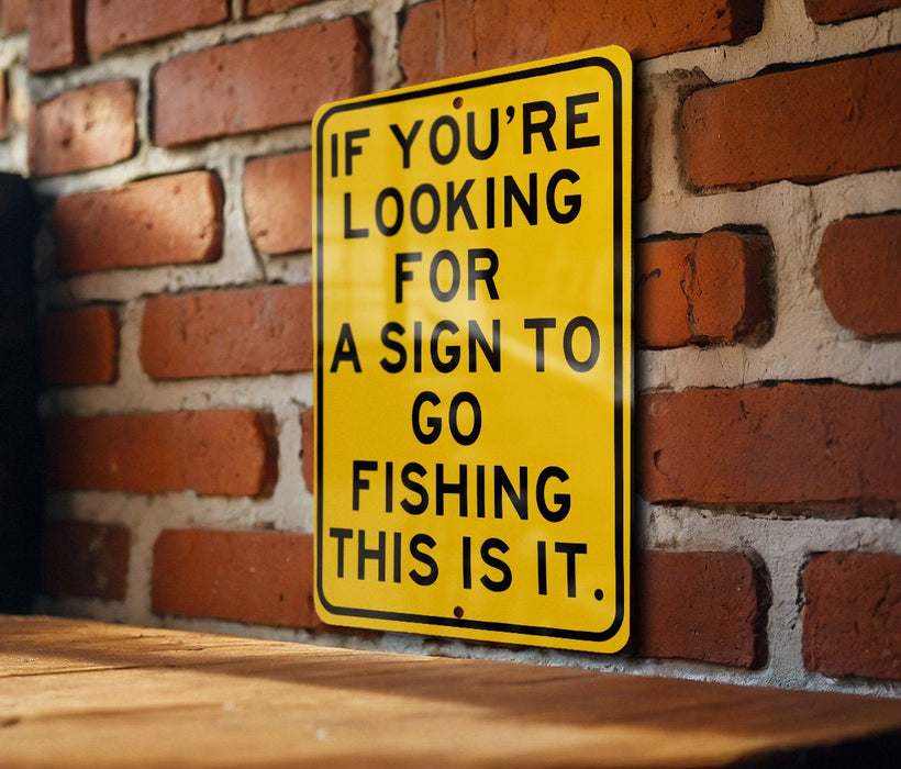 a yellow sign on a brick wall saying if you're looking for a sign
