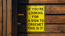a yellow sign that says if you're looking for a sign to croche