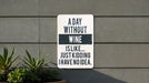 a sign on the side of a building that says a day without wine is like