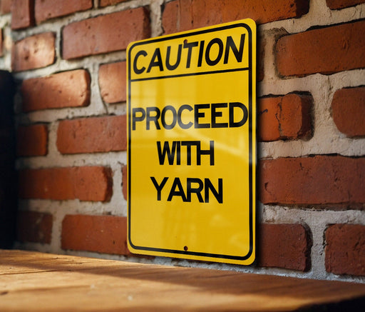 a yellow caution sign on a brick wall